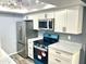 Modern kitchen features stainless steel appliances and updated countertops at 1230 N 84Th Pl, Scottsdale, AZ 85257