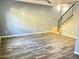 Living room features wood-look tile floors and staircase at 1230 N 84Th Pl, Scottsdale, AZ 85257