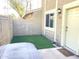 Private patio with artificial turf and access to the home at 1230 N 84Th Pl, Scottsdale, AZ 85257