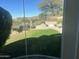 Landscaped backyard with grassy area, patio, and mountain views at 12646 N 17Th Pl, Phoenix, AZ 85022