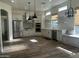 Modern kitchen with stainless steel appliances and eat-in bench seating at 12646 N 17Th Pl, Phoenix, AZ 85022