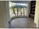 Home office with built-in shelving and curved window overlooking courtyard at 12646 N 17Th Pl, Phoenix, AZ 85022