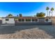 An expansive backyard showcasing desert landscaping, an AC unit, and solar panels at 142 W Ivanhoe Pl, Chandler, AZ 85225