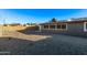 Spacious backyard featuring easy-care desert landscaping and a durable block fence at 142 W Ivanhoe Pl, Chandler, AZ 85225