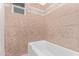 Clean, bright bathroom with tiled tub and shower at 142 W Ivanhoe Pl, Chandler, AZ 85225