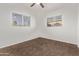 Bedroom featuring carpet flooring and ample natural light from the bright windows at 142 W Ivanhoe Pl, Chandler, AZ 85225