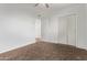 Bedroom with carpet flooring, ceiling fan, and closet at 142 W Ivanhoe Pl, Chandler, AZ 85225