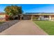 Charming house with a covered parking area and lush green grass in the front at 142 W Ivanhoe Pl, Chandler, AZ 85225