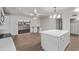 Modern kitchen with a center island and views of the backyard and living area at 142 W Ivanhoe Pl, Chandler, AZ 85225
