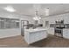 Bright kitchen featuring white cabinets, stainless steel appliances, and granite countertops at 142 W Ivanhoe Pl, Chandler, AZ 85225