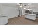 Open concept kitchen with stainless appliances, a central island and stylish wood look flooring at 142 W Ivanhoe Pl, Chandler, AZ 85225