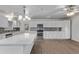 Bright kitchen featuring white cabinets, stainless steel appliances, and granite countertops at 142 W Ivanhoe Pl, Chandler, AZ 85225