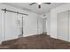Bedroom with ensuite bathroom and closet with sliding barn door at 142 W Ivanhoe Pl, Chandler, AZ 85225
