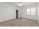 Bedroom with carpet, white walls, white trim, and a window with shutters at 2280 E Stephens Pl, Chandler, AZ 85225