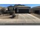 Charming single-story home featuring a well-maintained landscape, a two-car garage, and neutral color palette at 268 S San Jose Ln, Casa Grande, AZ 85194