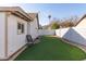 Artificial turf backyard with rocking chair and mountain views at 4110 E La Puente Ave, Phoenix, AZ 85044