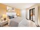 Cozy bedroom with a large bed, bedside tables, and access to a private outdoor space at 4303 E Cactus Rd # 146B, Phoenix, AZ 85032