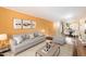 Bright living room featuring an open layout with a couch, coffee table, and dining area at 4303 E Cactus Rd # 146B, Phoenix, AZ 85032