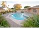 Charming kidney shaped pool with surrounding patio at 4616 W Lane Ave, Glendale, AZ 85301