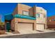 Tan two-story townhome with teal roof and two-car garage at 1015 S Val Vista Dr # 35, Mesa, AZ 85204