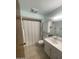 Bathroom featuring a shower, tile flooring, vanity, and cabinets for storage at 11012 W Thunderbird W Blvd, Sun City, AZ 85351