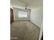 Cozy bedroom featuring carpet, a window with blinds, and a ceiling fan at 11012 W Thunderbird W Blvd, Sun City, AZ 85351