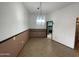 Inviting dining room space with tile floors and a hanging chandelier at 11012 W Thunderbird W Blvd, Sun City, AZ 85351