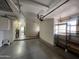 View of a well-lit garage featuring storage units and a door leading to another room at 11012 W Thunderbird W Blvd, Sun City, AZ 85351