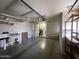 Spacious garage with a workbench, storage cabinets, and room for parking at 11012 W Thunderbird W Blvd, Sun City, AZ 85351