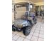 Golf cart parked in a residential area near a home at 11012 W Thunderbird W Blvd, Sun City, AZ 85351