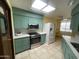 Modern kitchen features stainless steel appliances and plenty of counter space for food prep at 11012 W Thunderbird W Blvd, Sun City, AZ 85351