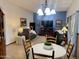 Cozy living room features an entertainment center with a fireplace and adjacent dining area at 11012 W Thunderbird W Blvd, Sun City, AZ 85351
