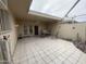 Covered patio area with tile flooring, furniture, and a ceiling fan at 11012 W Thunderbird W Blvd, Sun City, AZ 85351