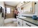 Updated bathroom with a tub, shower, and modern vanity at 1210 W Missouri Ave, Phoenix, AZ 85013