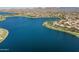 Expansive aerial view of the community lake with surrounding homes and landscape at 15312 S 181St Dr, Goodyear, AZ 85338