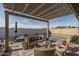 Inviting backyard with a sparkling pool, comfortable seating, and lush landscaping, perfect for outdoor living at 15312 S 181St Dr, Goodyear, AZ 85338