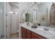 Bright bathroom features a double sink vanity and a separate toilet room for added privacy at 15312 S 181St Dr, Goodyear, AZ 85338