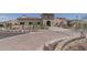 Stately stone-accented entrance to community building with well-maintained landscaping and paved driveway at 15312 S 181St Dr, Goodyear, AZ 85338