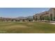 Expansive community lawn with seating areas and mountain views, perfect for outdoor enjoyment at 15312 S 181St Dr, Goodyear, AZ 85338