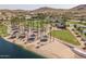 Community park featuring a sandy beach, picnic pavilions, and lush green spaces at 15312 S 181St Dr, Goodyear, AZ 85338