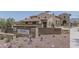 Elegant entrance to Presidio Residents Club with desert landscaping and building visible in background at 15312 S 181St Dr, Goodyear, AZ 85338