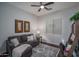 Comfortable living room with a cozy couch, accent decor, and ample natural light, creating a relaxing atmosphere at 15312 S 181St Dr, Goodyear, AZ 85338