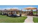 Community park with covered picnic areas, playground equipment, and landscaping at 15312 S 181St Dr, Goodyear, AZ 85338