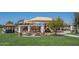 Community park with playground, covered picnic areas, and lush green grass at 15312 S 181St Dr, Goodyear, AZ 85338