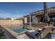 Beautiful pool, covered patio and comfortable lounge seating create an ideal space for outdoor entertaining at 15312 S 181St Dr, Goodyear, AZ 85338