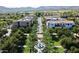 Beautiful aerial view of community's charming town center, palm trees, and surrounding mountains showcases desirable locale at 2135 N Heritage St, Buckeye, AZ 85396