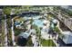 Aerial view of a resort-style community pool with multiple pools, lounge areas, and lush landscaping at 2135 N Heritage St, Buckeye, AZ 85396