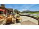 Inviting outdoor patio boasts comfortable seating, elegant decor, and stunning views of the surrounding lake and landscape at 2135 N Heritage St, Buckeye, AZ 85396