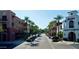 Street view of mixed use commercial and residential property lined with palm trees and many parked cars at 2135 N Heritage St, Buckeye, AZ 85396