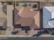 Aerial view of a single-story house with a tile roof, and a small backyard at 4047 E Catalina Cir, Mesa, AZ 85206